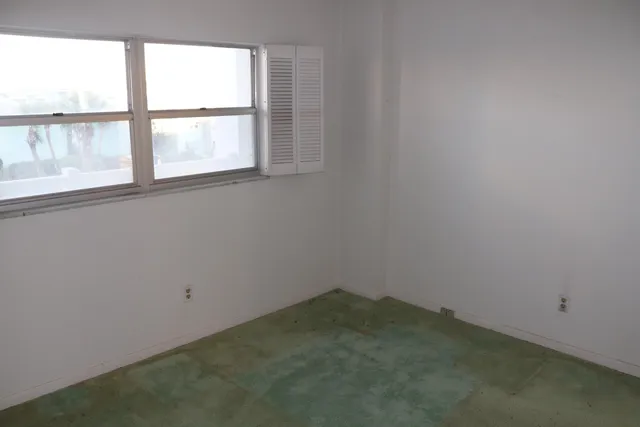 an empty room with a window