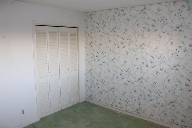 a bathroom with a toilet and shower