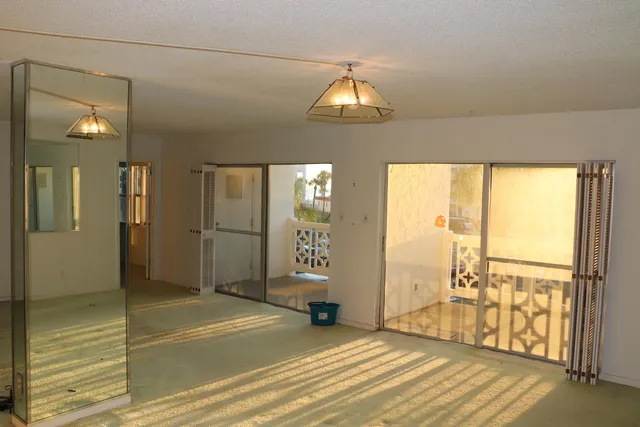 an empty room with entrance door