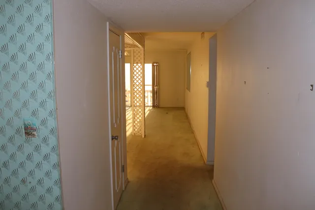 a view of hallway with livingroom