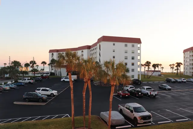 a kitchen with stainless steel appliances kitchen island sink stove and living room