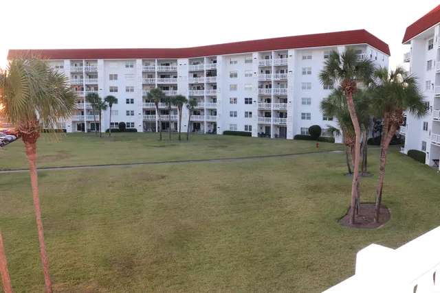 a room with furniture and wooden cabinets