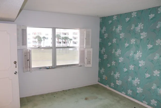 a view of an empty room with a window