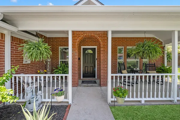 a front view of a house with a porch