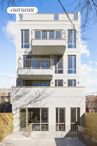 a front view of a building with an outdoor space