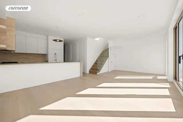 a kitchen with granite countertop a sink stainless steel appliances and cabinets