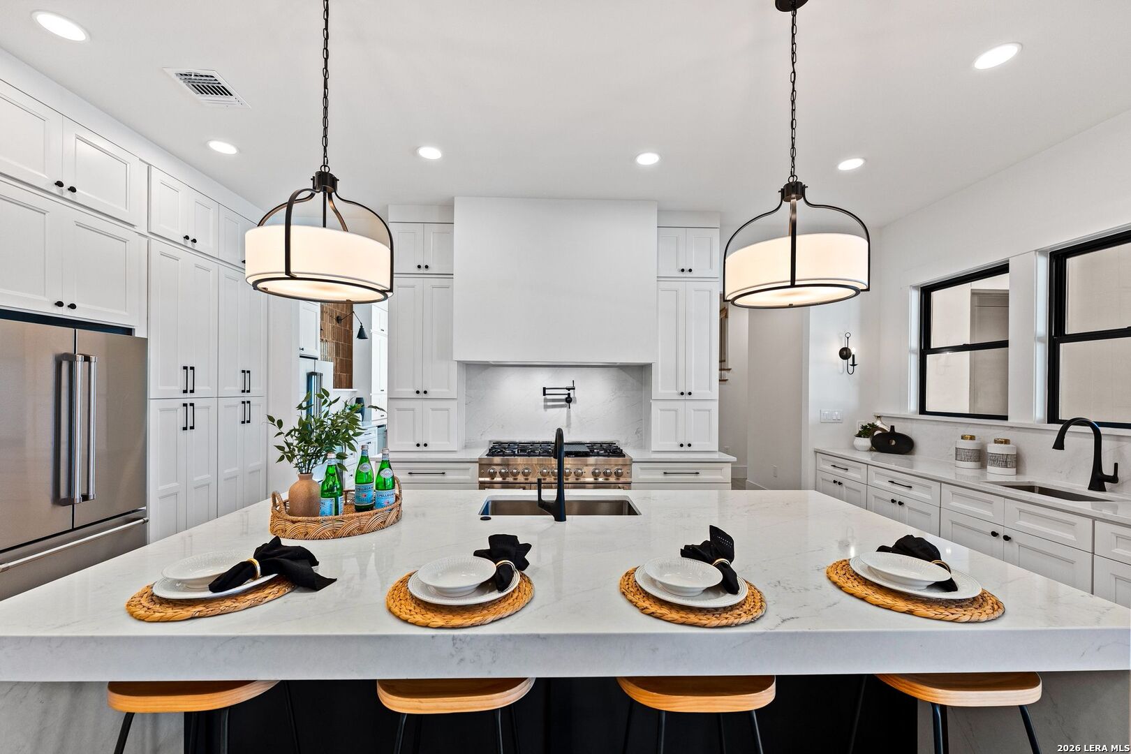 34793 High Gate Road Bulverde, TX 78163 - Photo 13 of 50 a kitchen with furniture and a chandelier