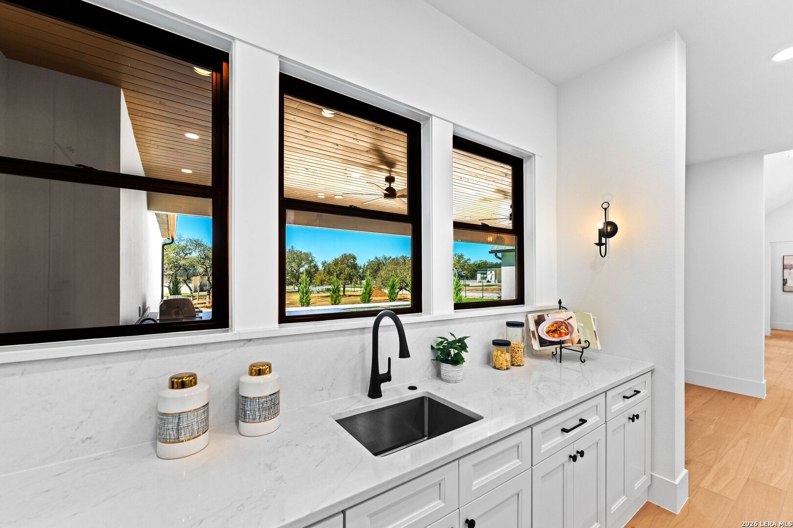 34793 High Gate Road Bulverde, TX 78163 - Photo 14 of 50 a kitchen with a window a sink and cabinets