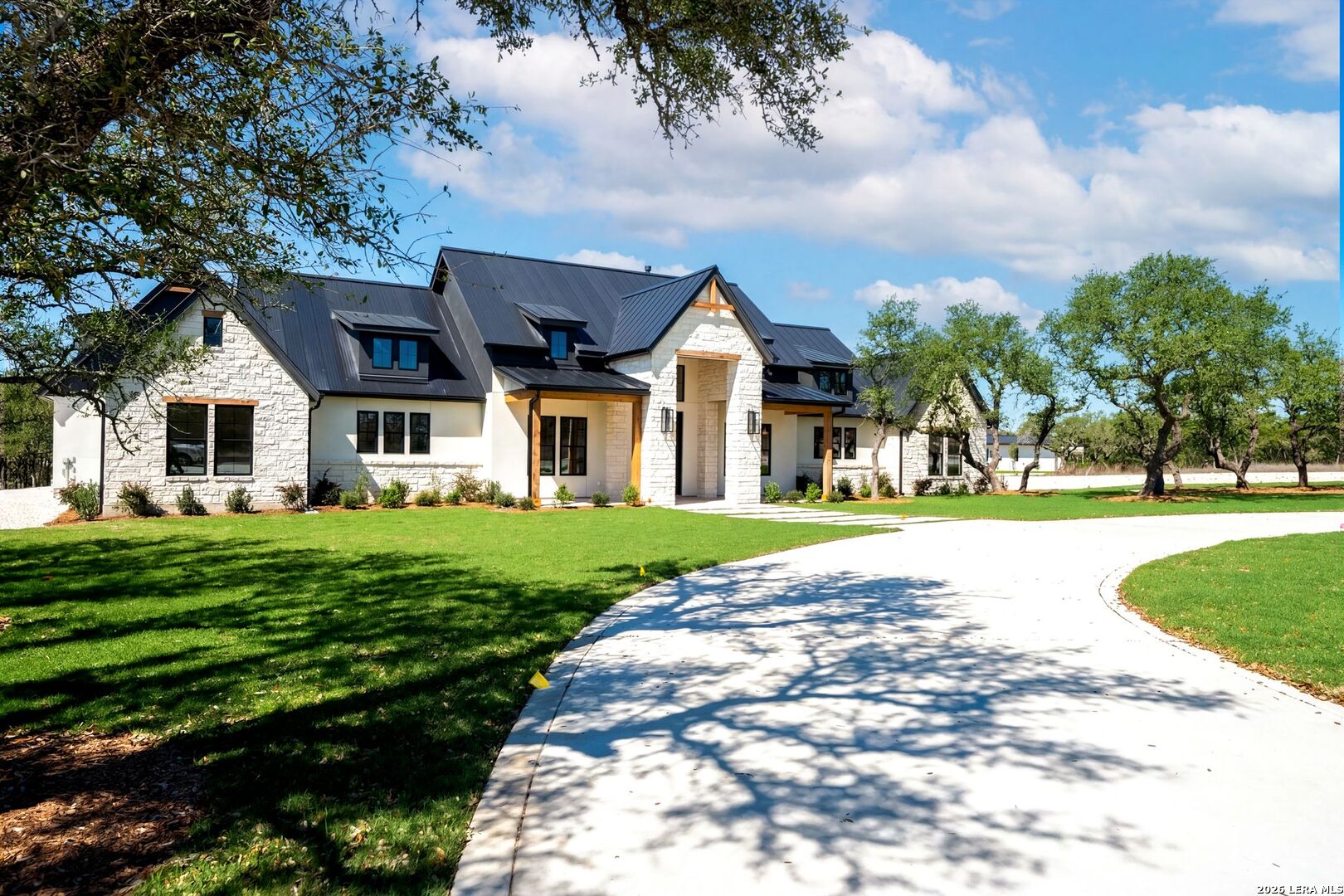 34793 High Gate Road Bulverde, TX 78163 - Photo 2 of 50 a front view of a house with a yard