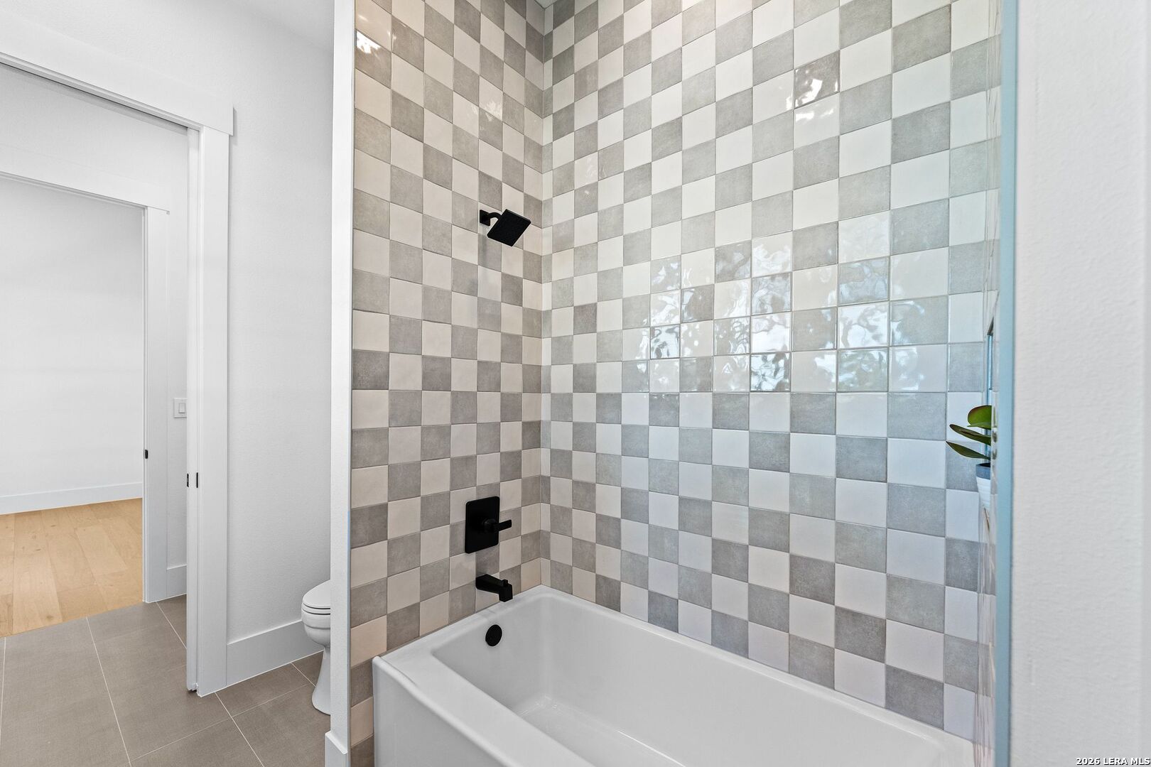 34793 High Gate Road Bulverde, TX 78163 - Photo 23 of 50 a bathroom with a bathtub and a shower