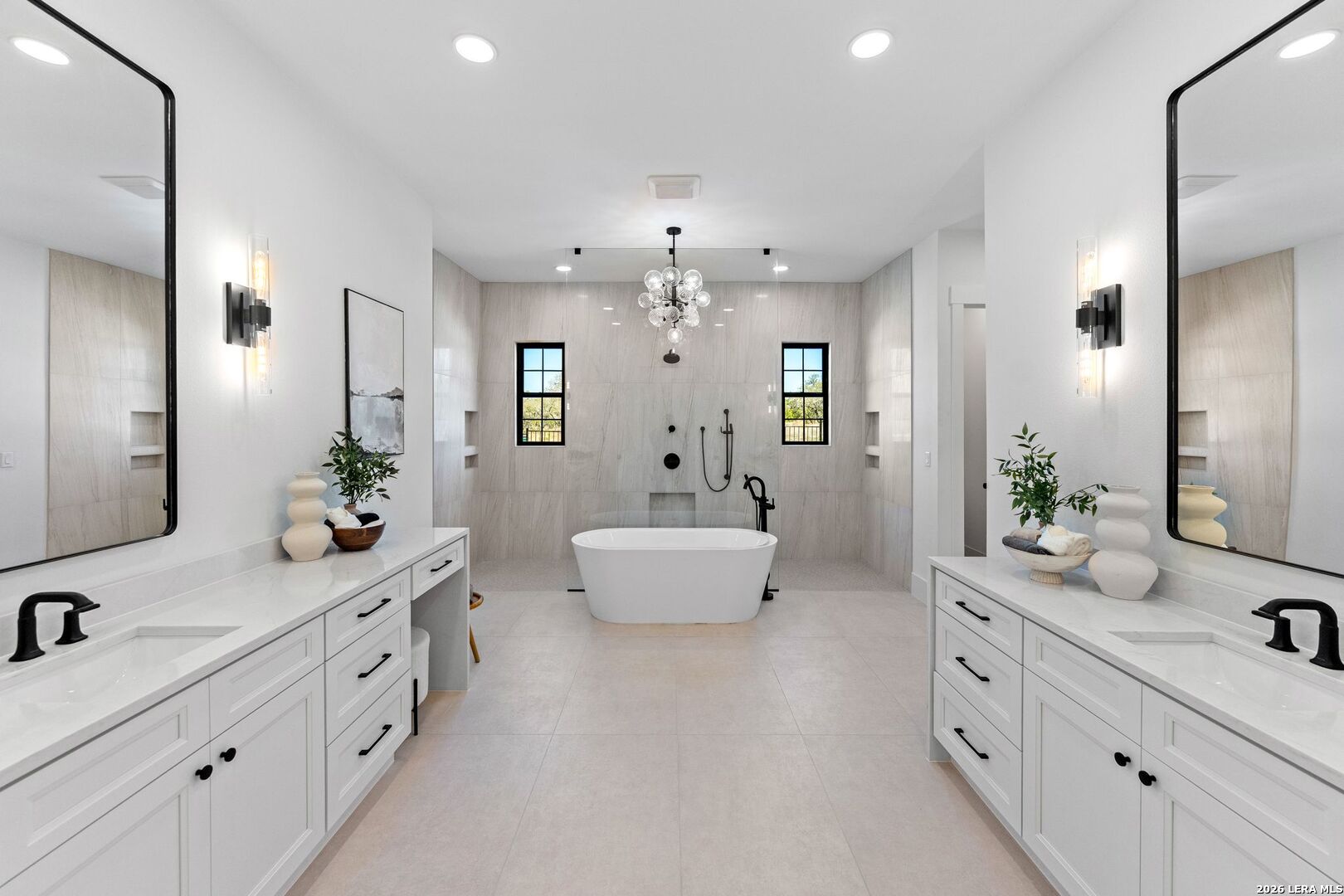 34793 High Gate Road Bulverde, TX 78163 - Photo 28 of 50 a spacious en suite bathroom with double sink and mirror