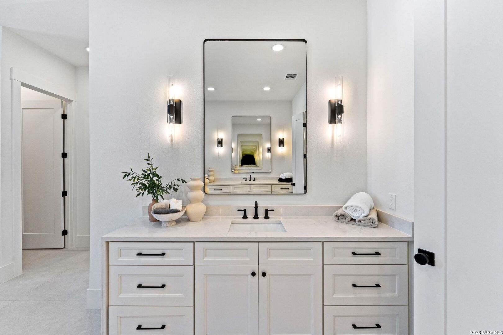 34793 High Gate Road Bulverde, TX 78163 - Photo 31 of 50 a bathroom with a granite countertop sink and a mirror