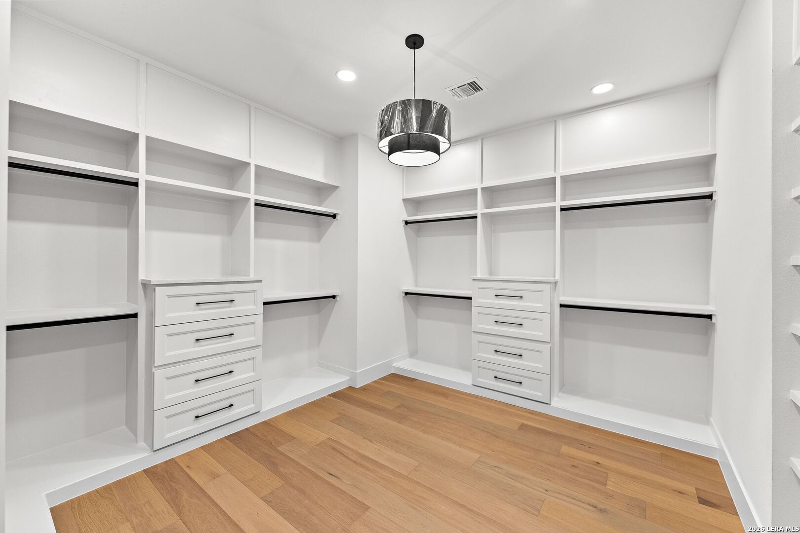 34793 High Gate Road Bulverde, TX 78163 - Photo 32 of 50 a view of walk in closet with empty racks