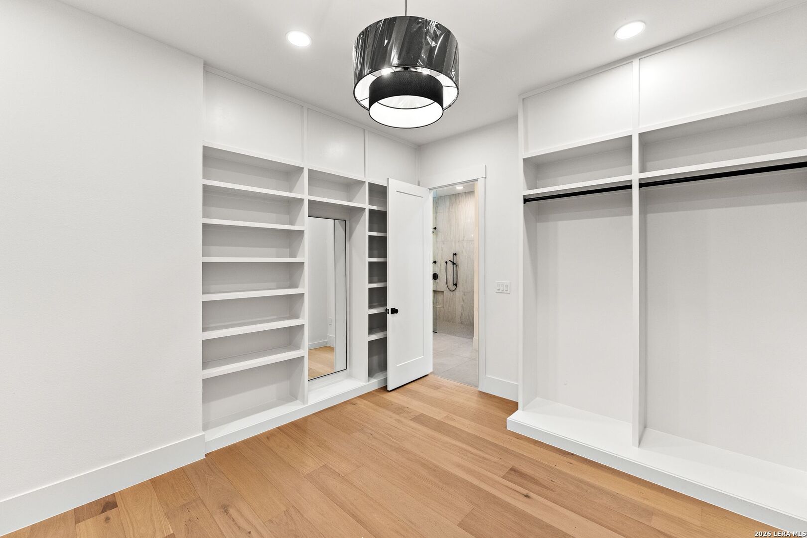 34793 High Gate Road Bulverde, TX 78163 - Photo 33 of 50 a view of a room with wooden floor and closet