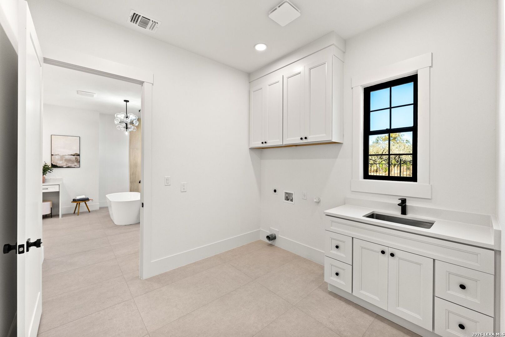 34793 High Gate Road Bulverde, TX 78163 - Photo 34 of 50 a bathroom with a sink vanity and a mirror
