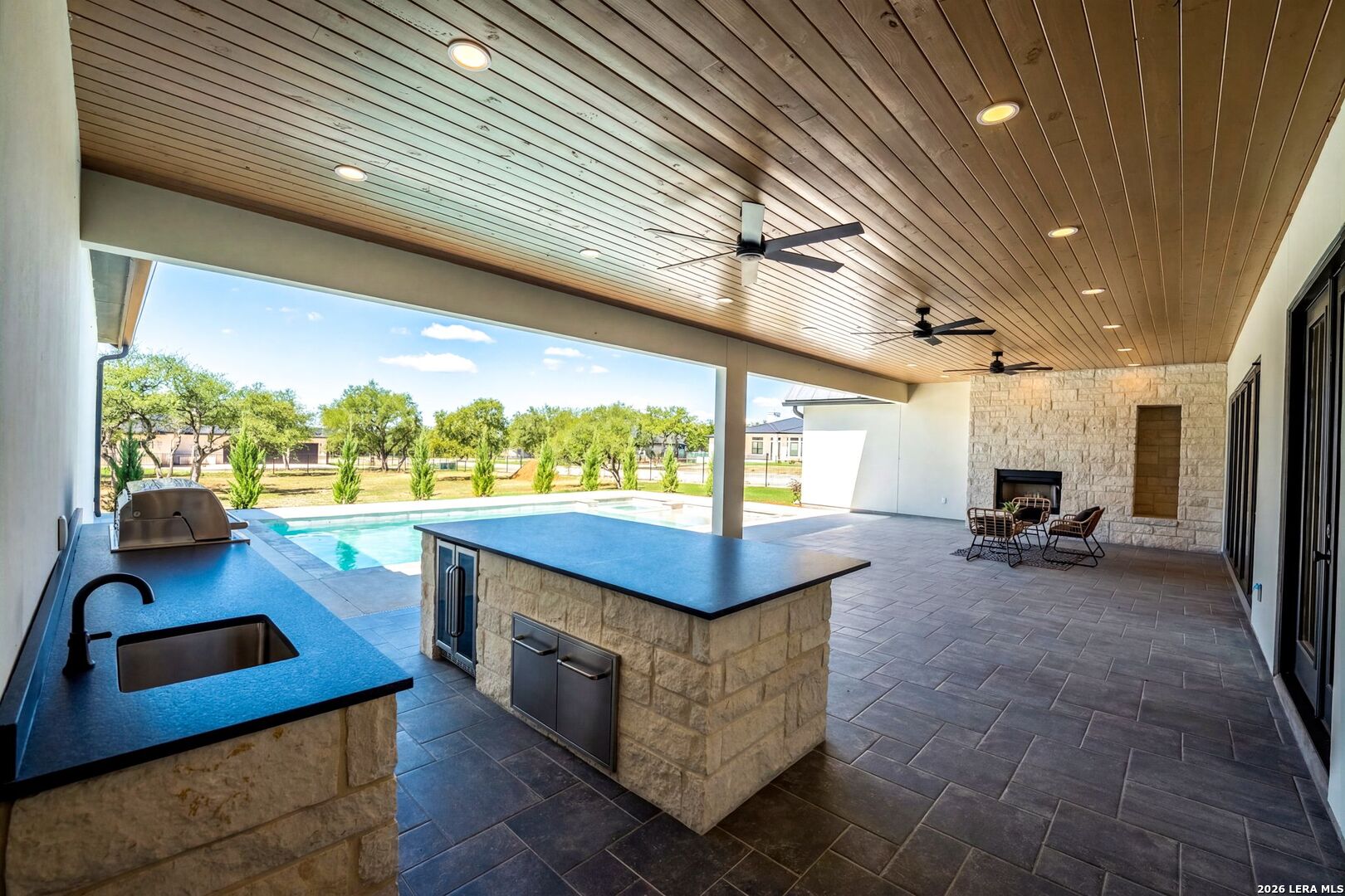 34793 High Gate Road Bulverde, TX 78163 - Photo 40 of 50 a living room with patio furniture and a floor to ceiling window