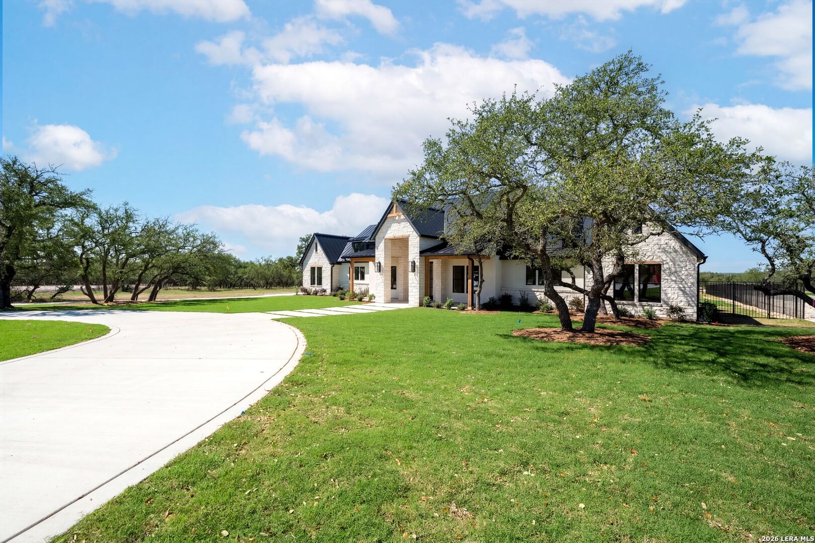 34793 High Gate Road Bulverde, TX 78163 - Photo 4 of 50 a view of a house with a yard and sitting area