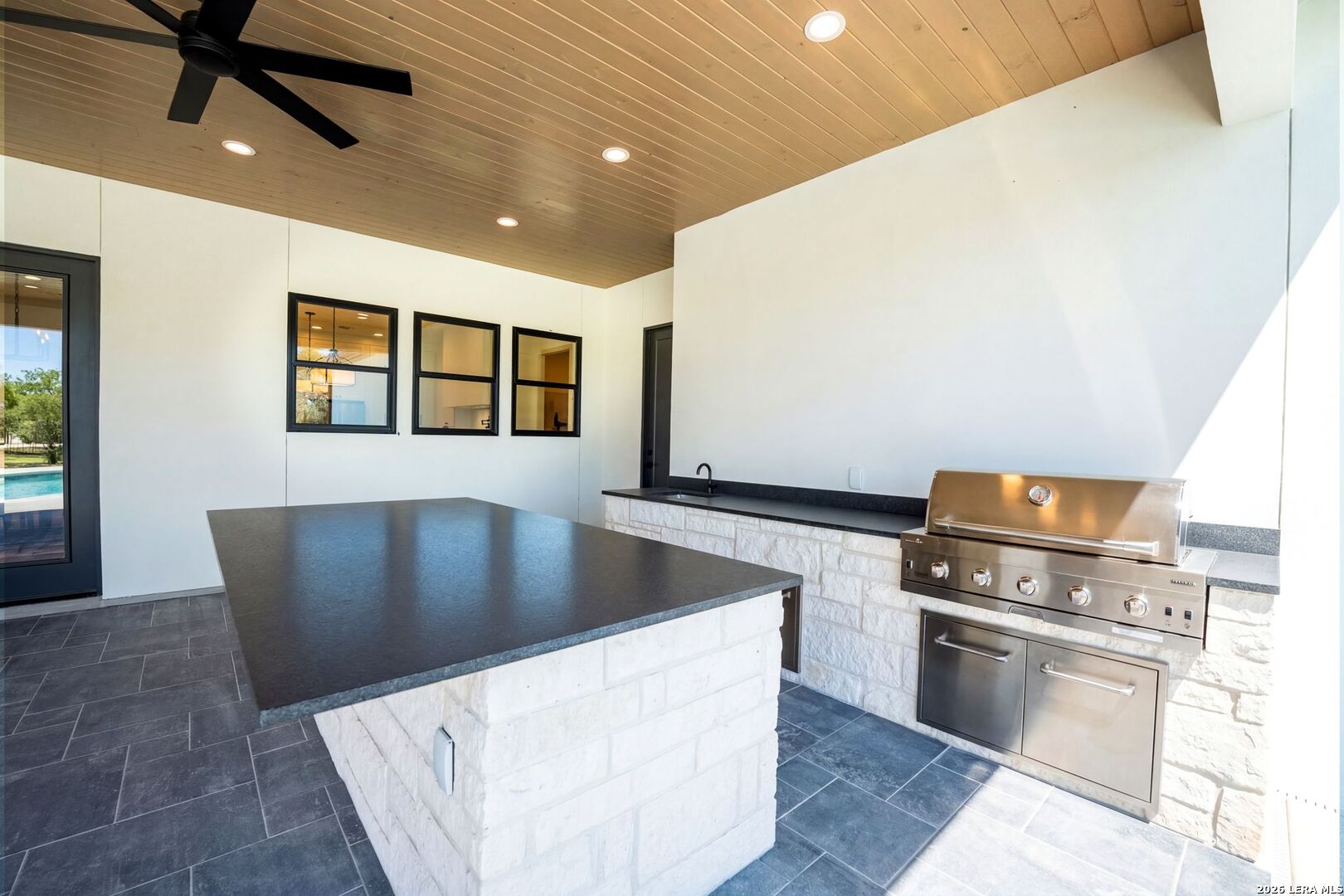 34793 High Gate Road Bulverde, TX 78163 - Photo 41 of 50 a view of kitchen with a stove wooden cabinets and entryway