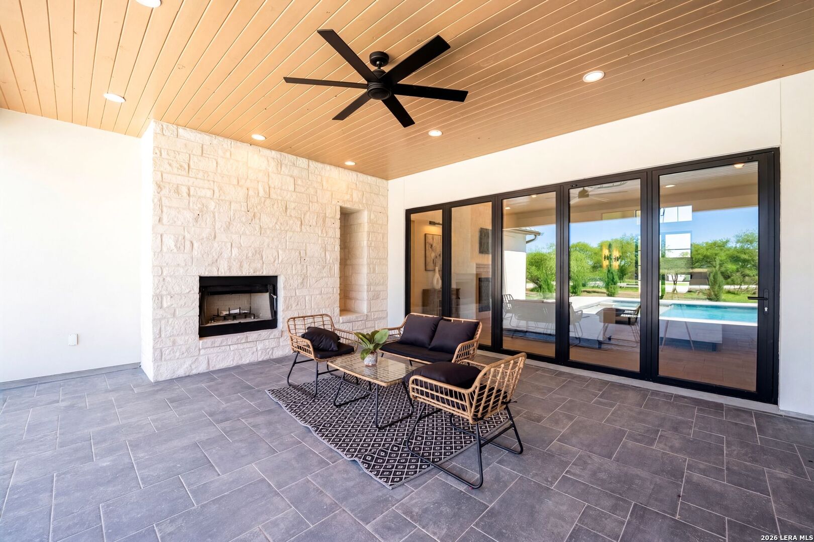 34793 High Gate Road Bulverde, TX 78163 - Photo 42 of 50 a living room with furniture and a floor to ceiling window