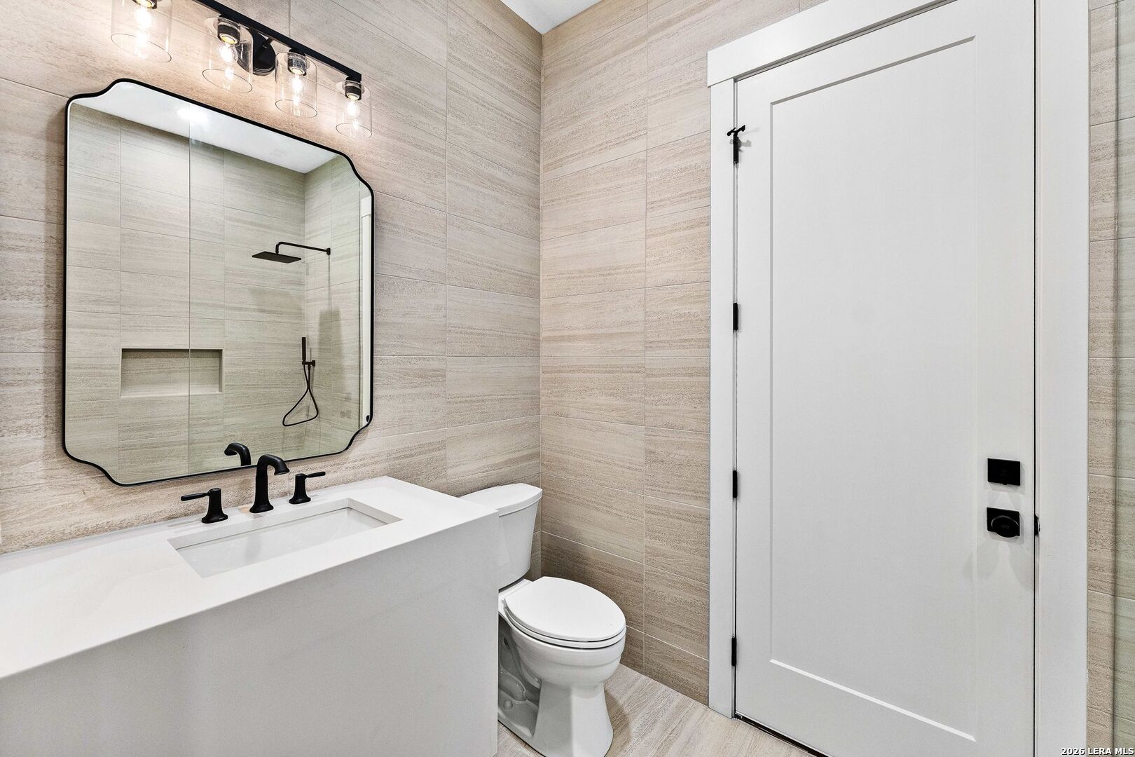 34793 High Gate Road Bulverde, TX 78163 - Photo 46 of 50 a bathroom with a sink a toilet a mirror and shower