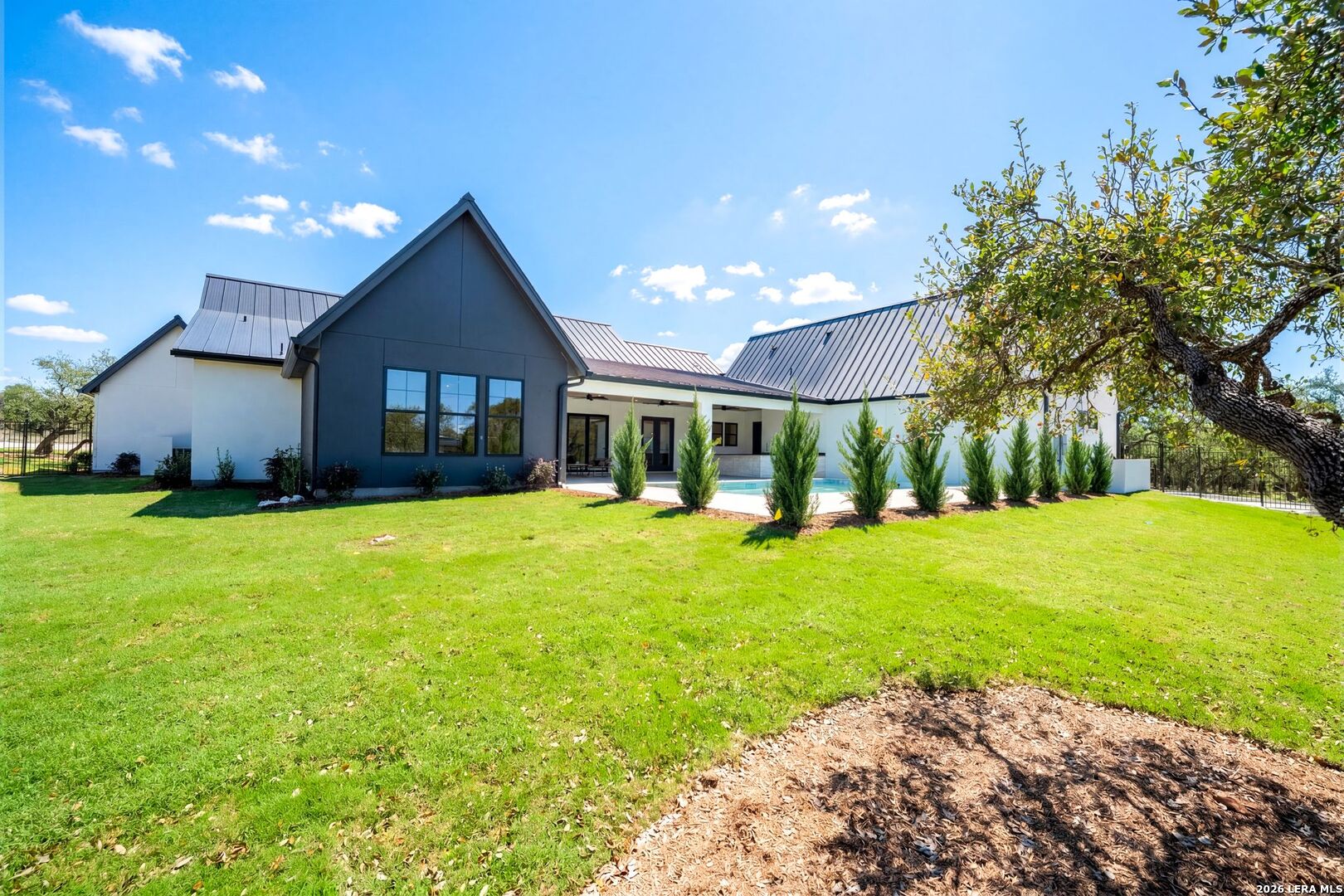 34793 High Gate Road Bulverde, TX 78163 - Photo 48 of 50 a front view of a house with garden