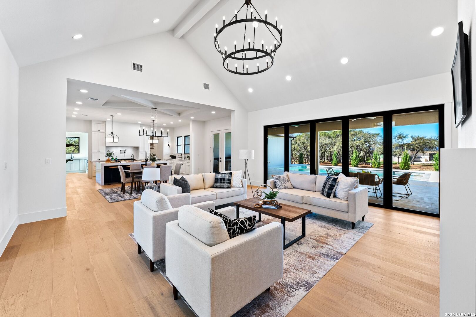 34793 High Gate Road Bulverde, TX 78163 - Photo 9 of 50 a living room with furniture large window and wooden floor