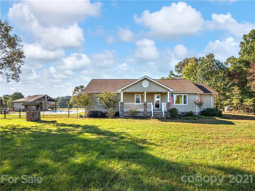 588 Lee Cudd Road Rutherfordton, NC 28139 - Photo 1 of 42 a front view of a house with yard and swimming pool