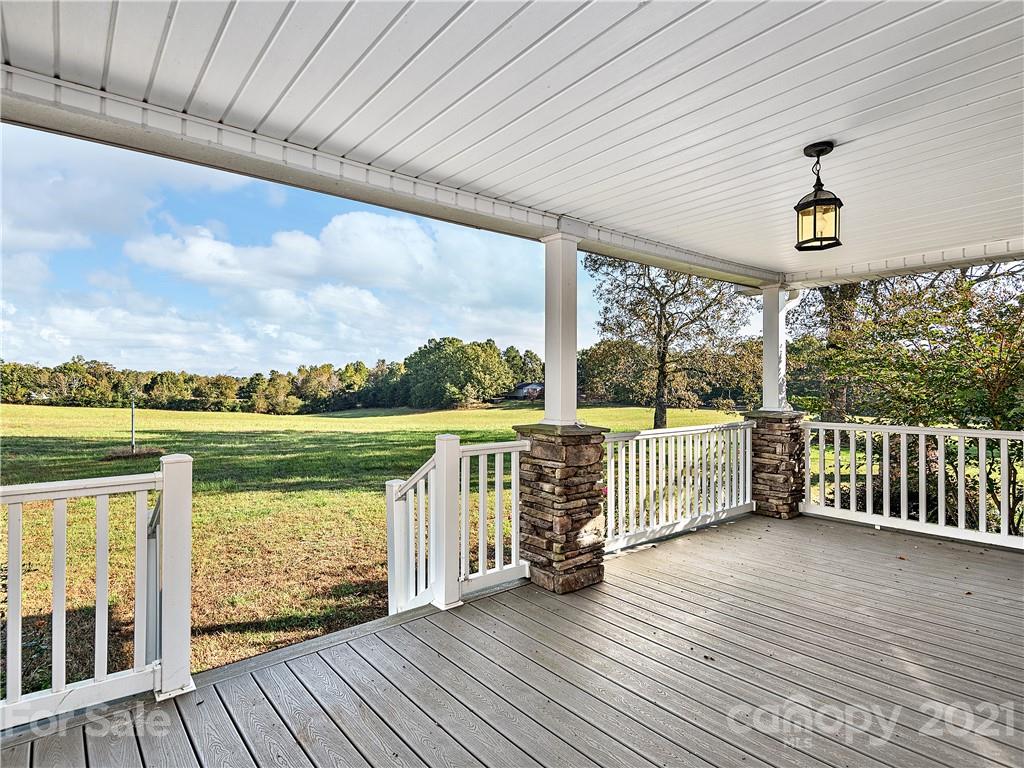 588 Lee Cudd Road Rutherfordton, NC 28139 - Photo 2 of 42 a view of a balcony with lake view and wooden floor