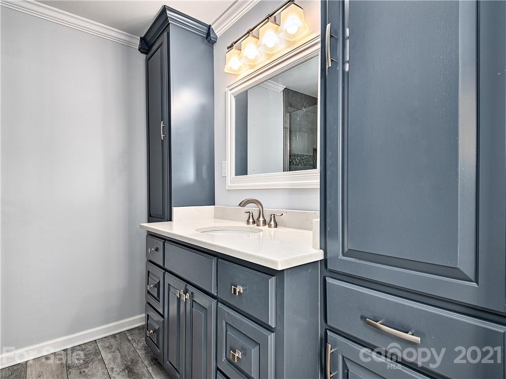 588 Lee Cudd Road Rutherfordton, NC 28139 - Photo 13 of 42 a bathroom with a sink and a mirror