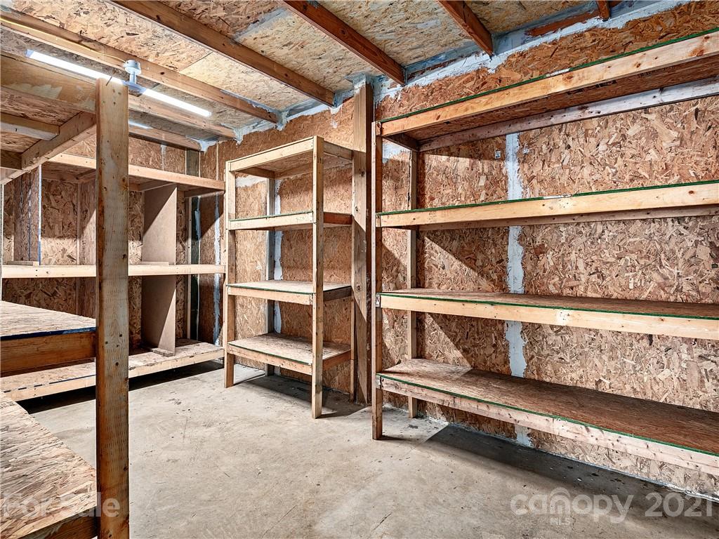 588 Lee Cudd Road Rutherfordton, NC 28139 - Photo 22 of 42 a view of an empty room with wooden floor and windows