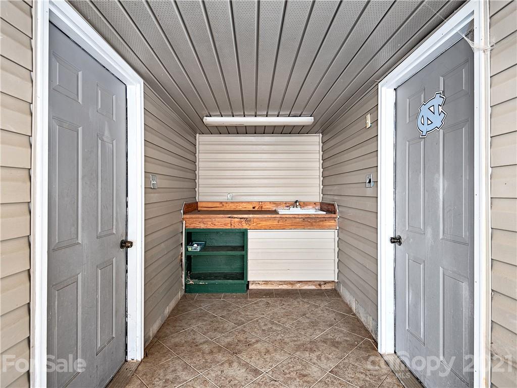 588 Lee Cudd Road Rutherfordton, NC 28139 - Photo 28 of 42 a view of a house with a door and wooden walls