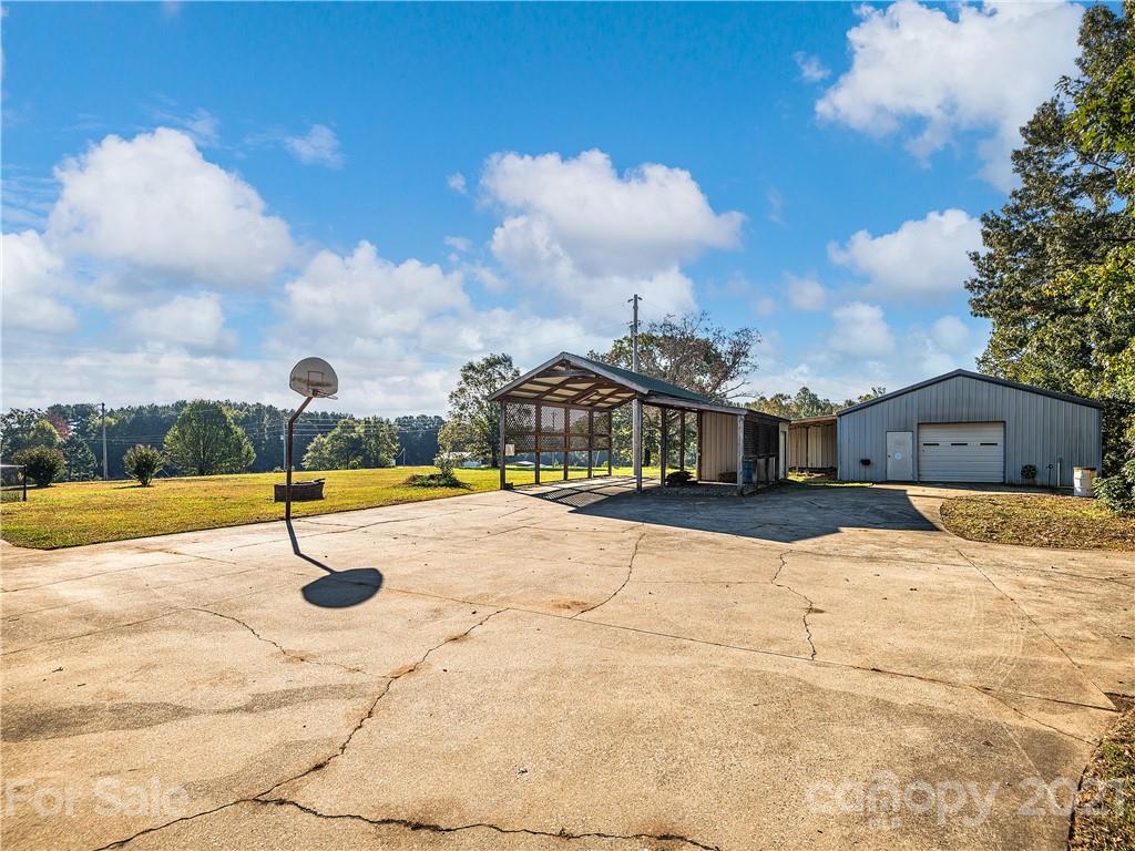 588 Lee Cudd Road Rutherfordton, NC 28139 - Photo 34 of 42 a swimming pool in front of the house