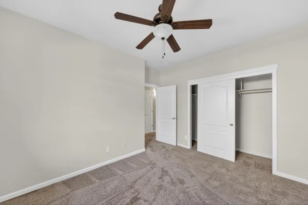 a view of room with ceiling fan