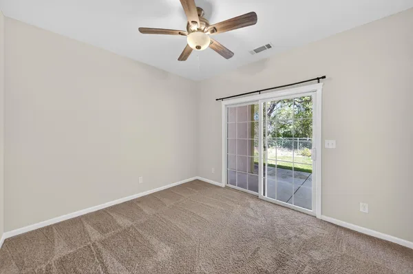 an empty room with fan