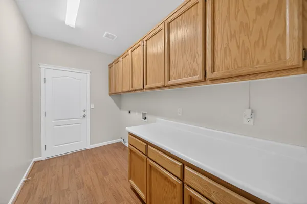 a view of cabinets with wooden floor