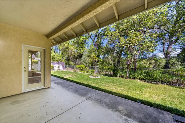 a view of a back yard and green space