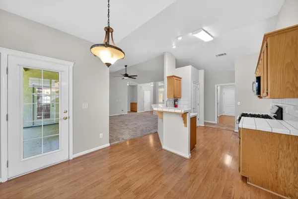 a view of a living room and a wooden floor