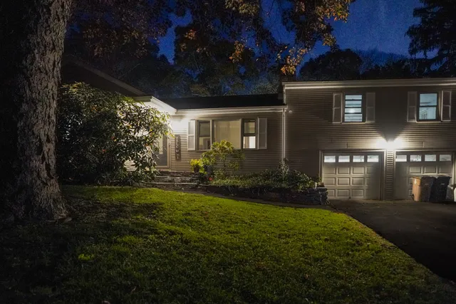 a front view of a house with a yard