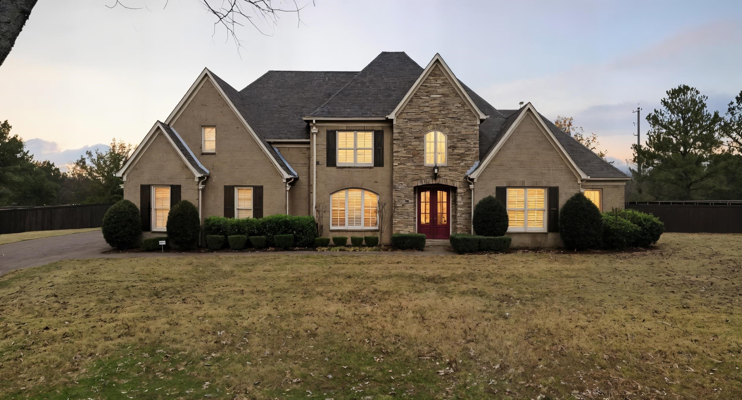 a front view of a house with a yard