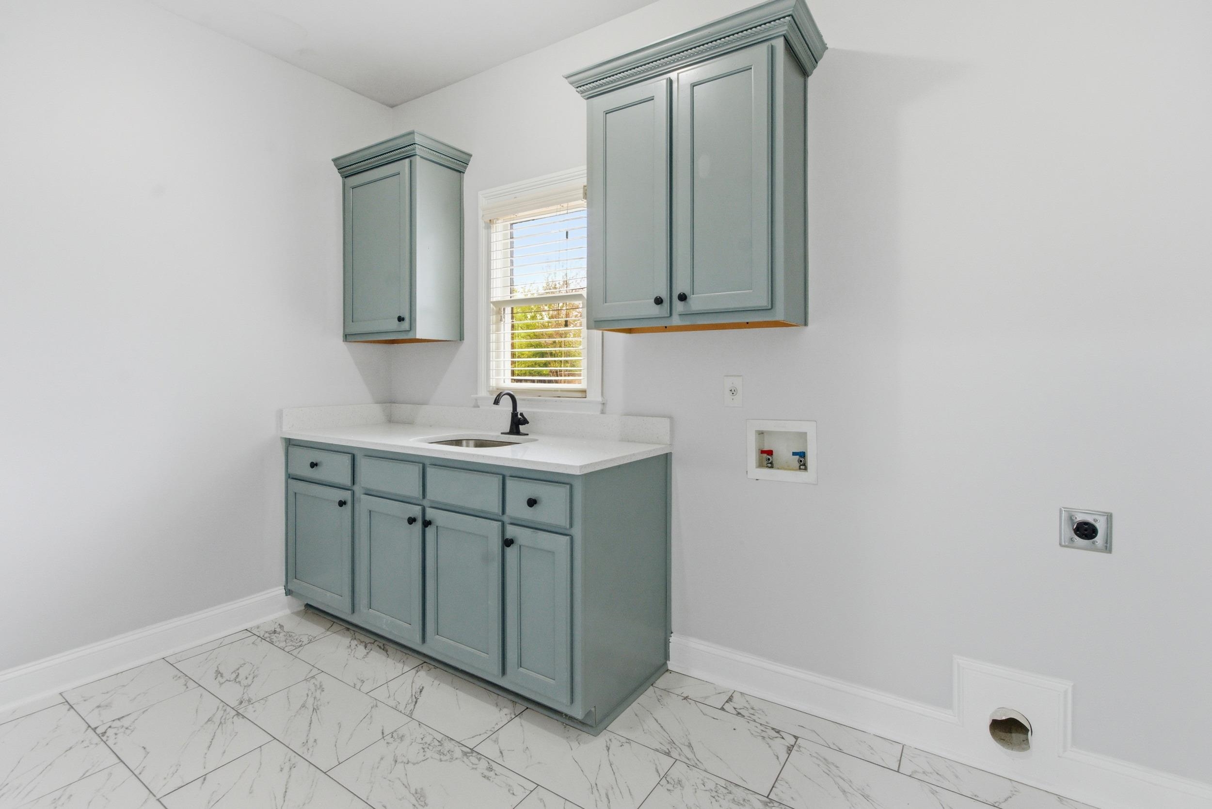 11080 Shelby Post Road Collierville, TN 38017 - Photo 13 of 39 Washroom with washer hookup, cabinet space, light marble finish floors, and electric dryer hookup
