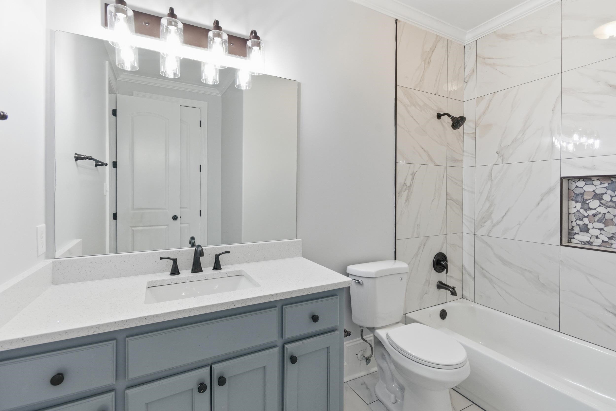 11080 Shelby Post Road Collierville, TN 38017 - Photo 25 of 39 Full bathroom with crown molding, tub / shower combination, and vanity