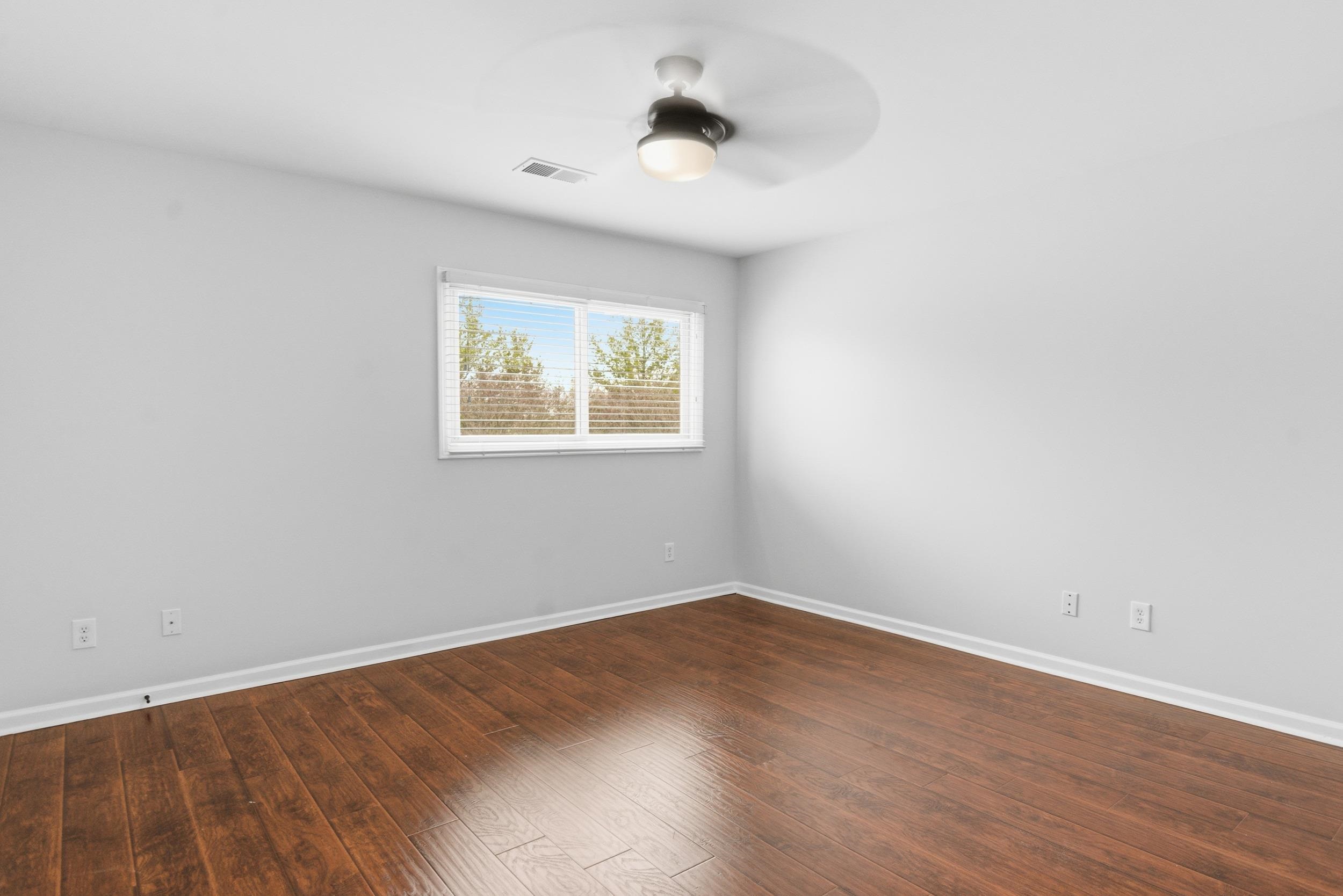 11080 Shelby Post Road Collierville, TN 38017 - Photo 28 of 39 Spare room featuring dark wood-style floors and ceiling fan
