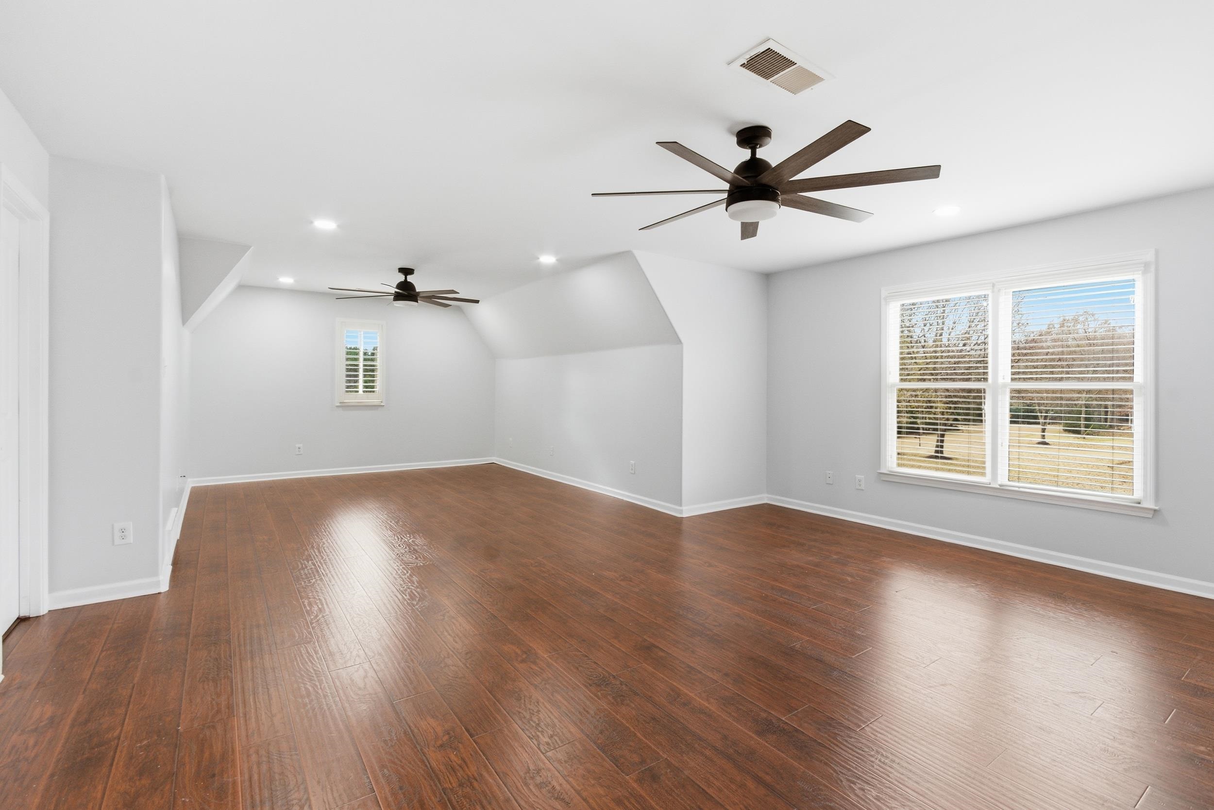11080 Shelby Post Road Collierville, TN 38017 - Photo 30 of 39 Bonus room featuring dark wood-type flooring, ceiling fan, and recessed lighting