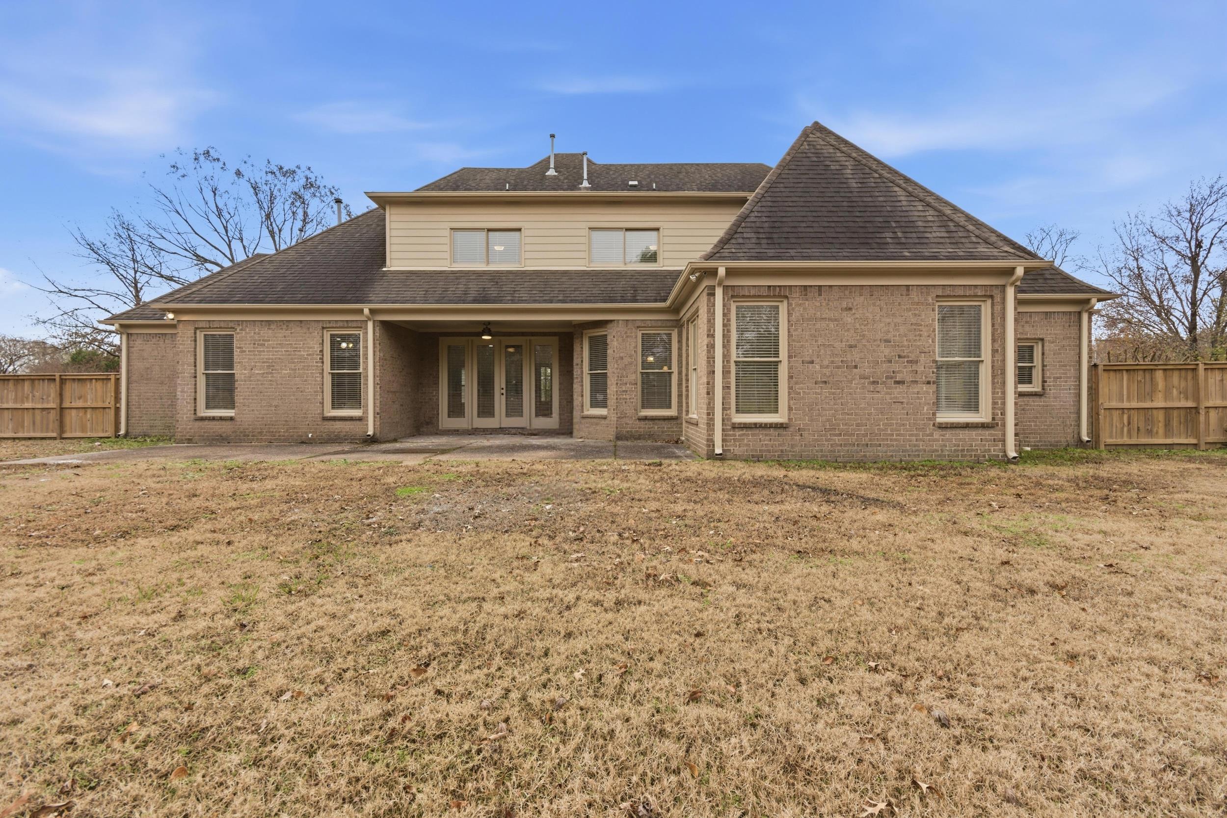 11080 Shelby Post Road Collierville, TN 38017 - Photo 33 of 39 Rear view of property with a patio, brick siding, a shingled roof, and french doors