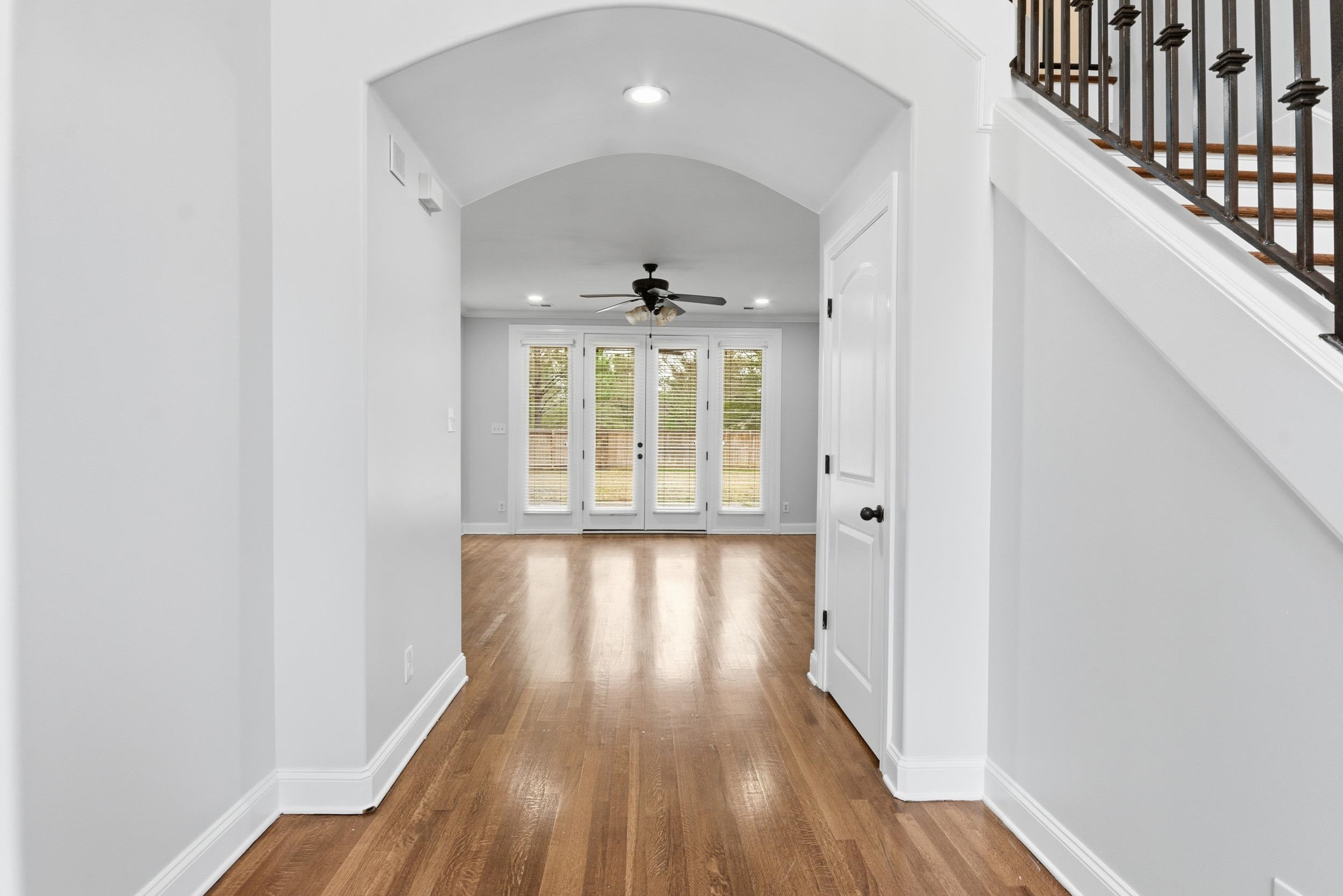 11080 Shelby Post Road Collierville, TN 38017 - Photo 4 of 39 Hallway featuring arched walkways, recessed lighting, and wood-type flooring