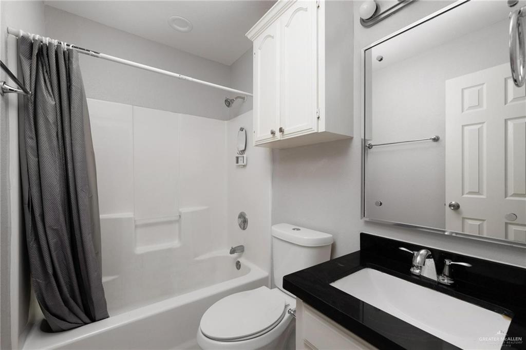 3505 Amando Street, Unit 3 Edinburg, TX 78539 - Photo 12 of 17 a bathroom with a sink a toilet and shower