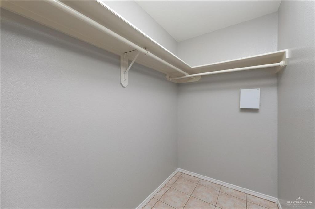 3505 Amando Street, Unit 3 Edinburg, TX 78539 - Photo 13 of 17 a view of walk in closet with empty racks