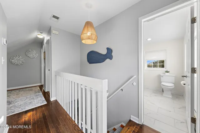 a view of a walk in closet and bathroom