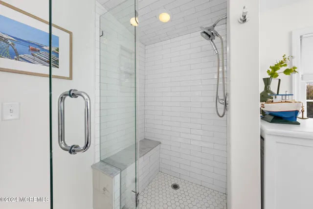 a bathroom with a shower and a tub