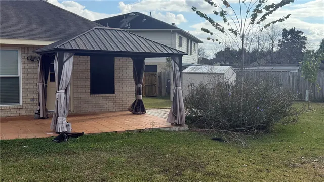 a backyard of a house with a small yard